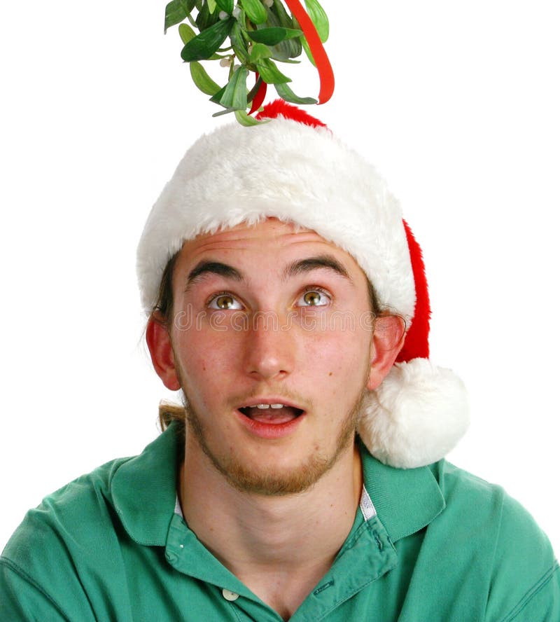 Surprised Young Man Under Mistletoe royalty free stock images Surprised Young Man Under Mistletoe royalty free stock images