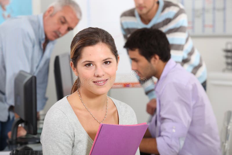 Surrounded by her colleagues stock photo Surrounded by her colleagues stock photo