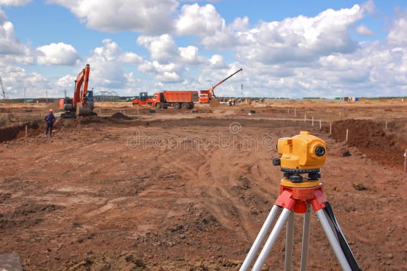 Surveying measuring equipment level theodolite on tripod.