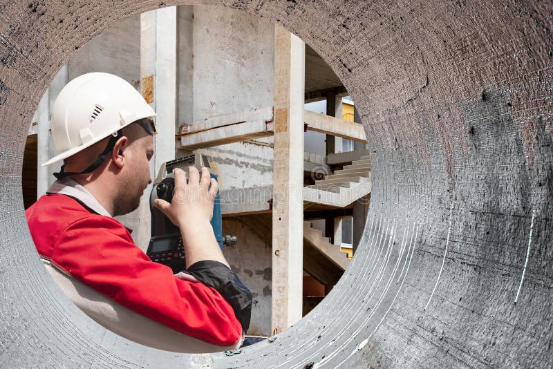 Surveyor engineer is measuring level on construction site. Surveyors ensure precise measurements before undertaking large