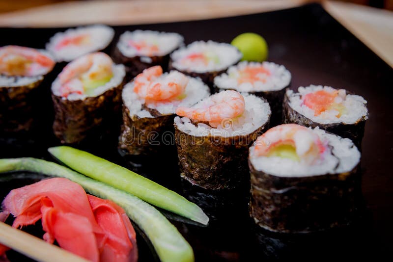 Sushi on a Black Black Plate. Restaurant. Stock Photo Image of