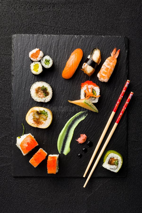 Sushi on Black Stone Plate on a Stone Table Stock Image Image of fish