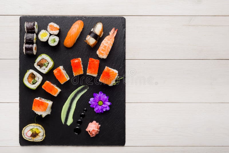 Sushi on Black Stone Plate on a Wooden Table Stock Photo Image of