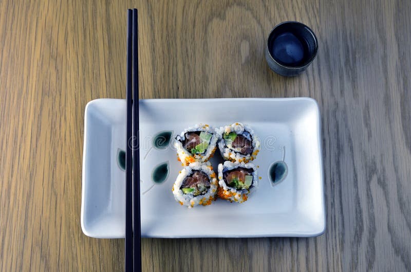 Sushi, chopsticks and sake
