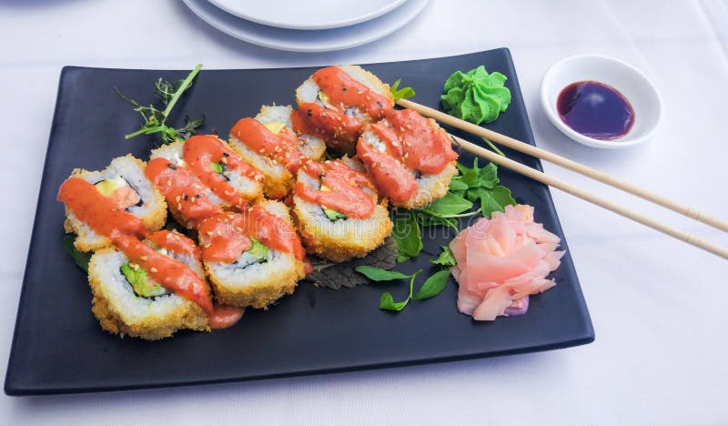 Futomaki with Fried Tuna, Salmon and Cream Cheese Served on Stone Plate ...