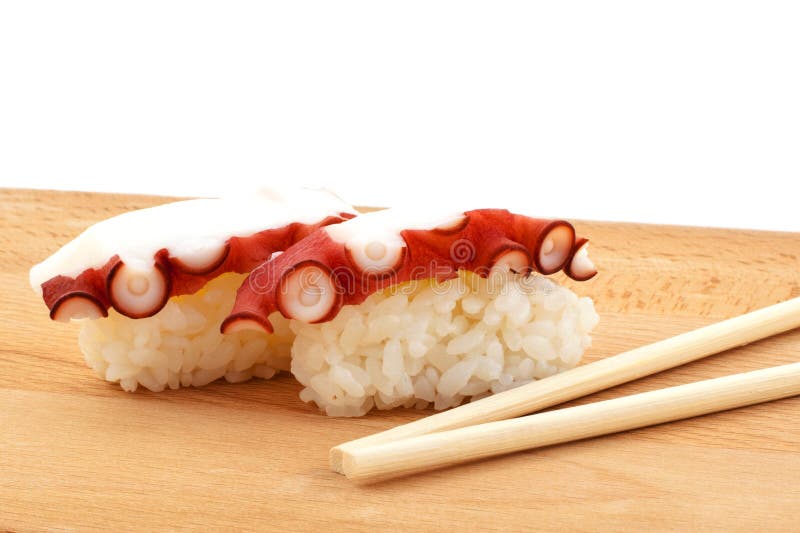 Sushi with octopus and wood chopsticks