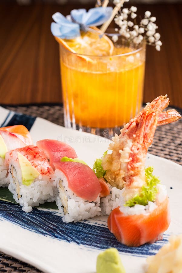 Sushi Plate and a Cocktail in a Japanese Restaurant Stock Image - Image