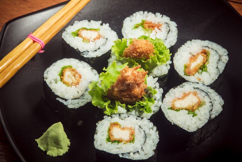 Sushi Roll with Chicken and Lettuce on Black Plate Stock Photo Image