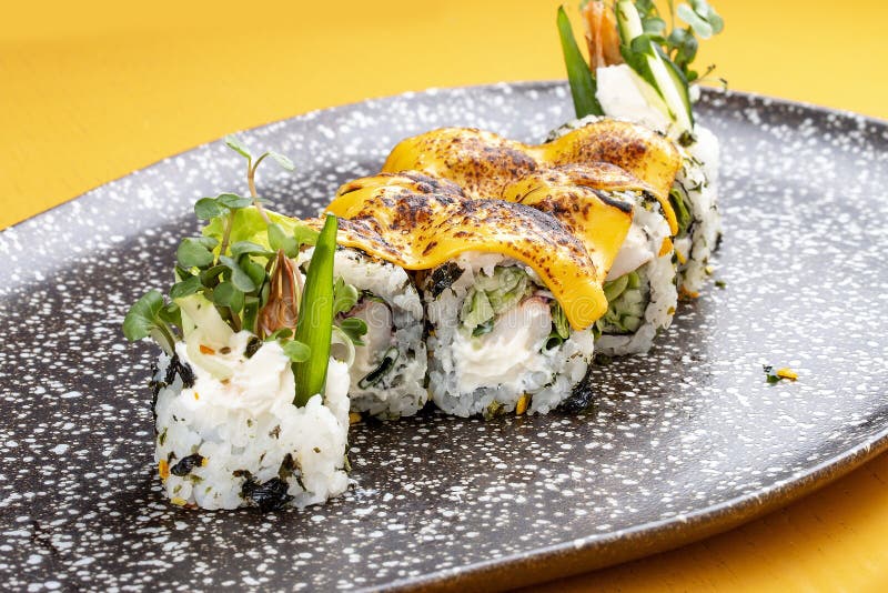 Sushi Roll with Crab Under Melted Cheese. Sushi Trend Stock Photo