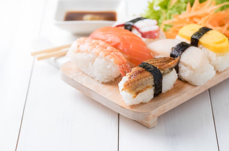 Sushi with sauce and wasabi on wood plate royalty free stock photo Sushi with sauce and wasabi on wood plate royalty free stock photo