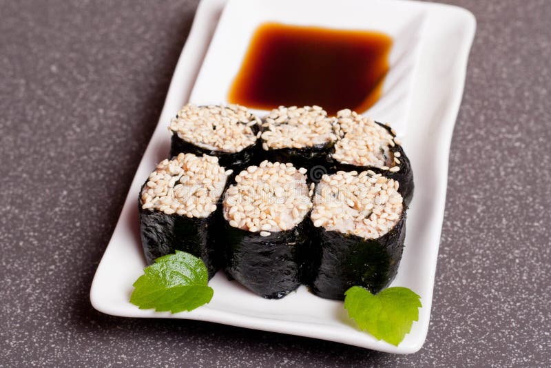 Sushi on a white plate stock photos Sushi on a white plate stock photos