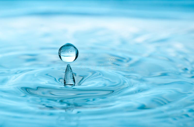 Drop Of Liquid Suspended Above Stock Photo Image of droplet, serving