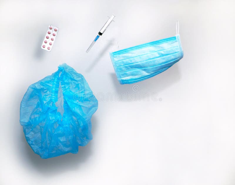 Suspended medical items, levitation: cap, glove, mask, pills and doctor`s hand. Background for healthcare topics royalty free stock photos Suspended medical items, levitation: cap, glove, mask, pills and doctor`s hand. Background for healthcare topics royalty free stock photos