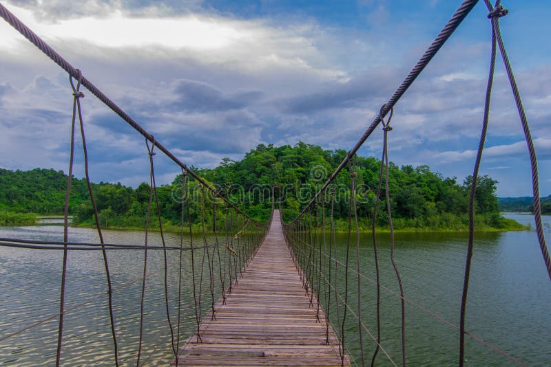 Suspension bridge across to the island on a cloudy day,Touris popular in Thailand