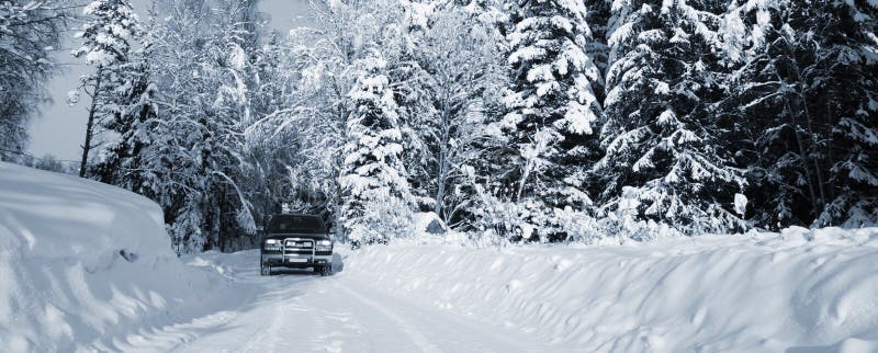 Large suv, driving on small snowy road through a swedish winter scenery. smaland, sweden. Large suv, driving on small snowy road through a swedish winter scenery. smaland, sweden