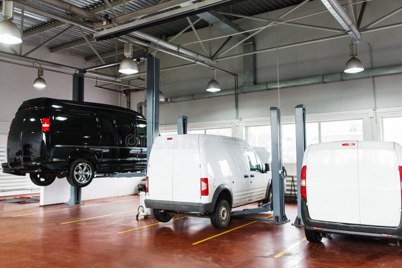 SUV service station, minibus raised up on lift royalty free stock photo SUV service station, minibus raised up on lift royalty free stock photo