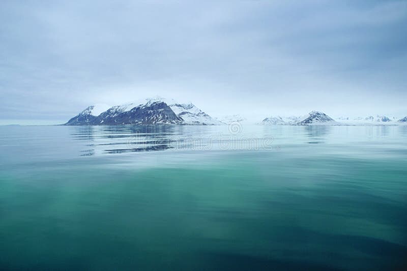 Svalbard sea view. Spitsbergen (Svalbard) mountains viewed from the ship in June, middle of polar day stock photography Svalbard sea view. Spitsbergen (Svalbard) mountains viewed from the ship in June, middle of polar day stock photography