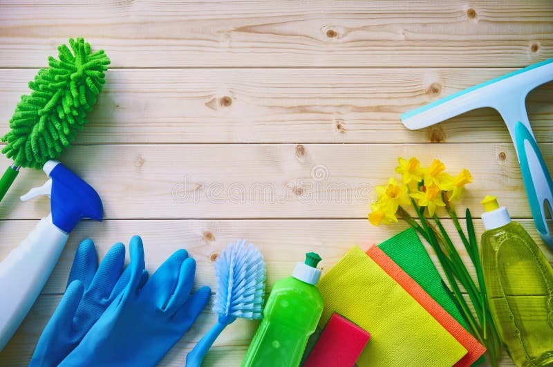 Cleaning concept. Housecleaning. Cleaning supplies on wooden board. Cleaning concept. Housecleaning. Cleaning supplies on wooden board