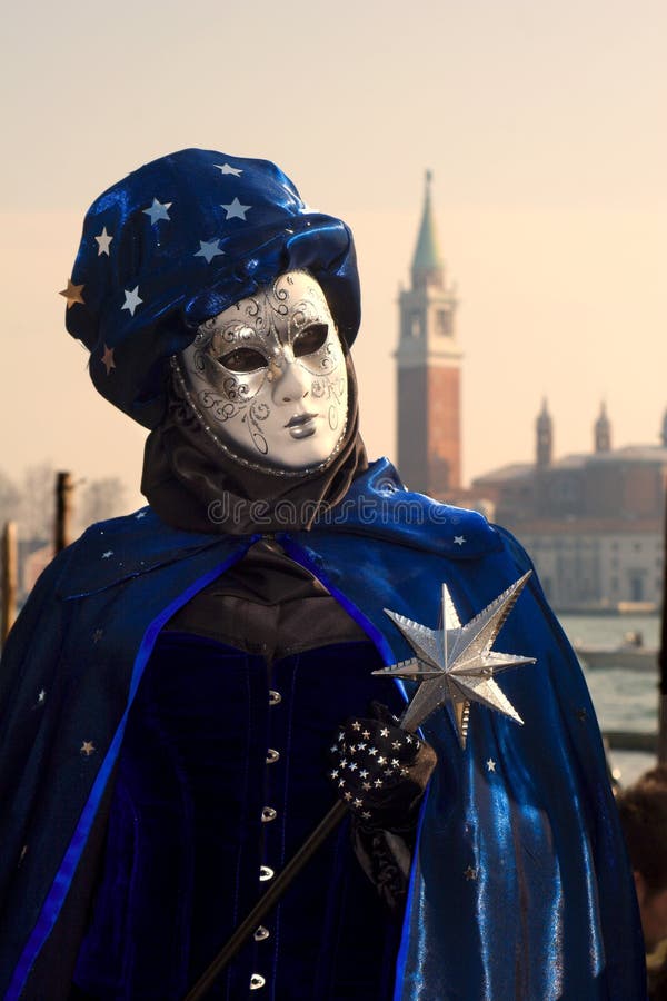 Black-blue mask from venice carnival and san Giorgion church. Black-blue mask from venice carnival and san Giorgion church