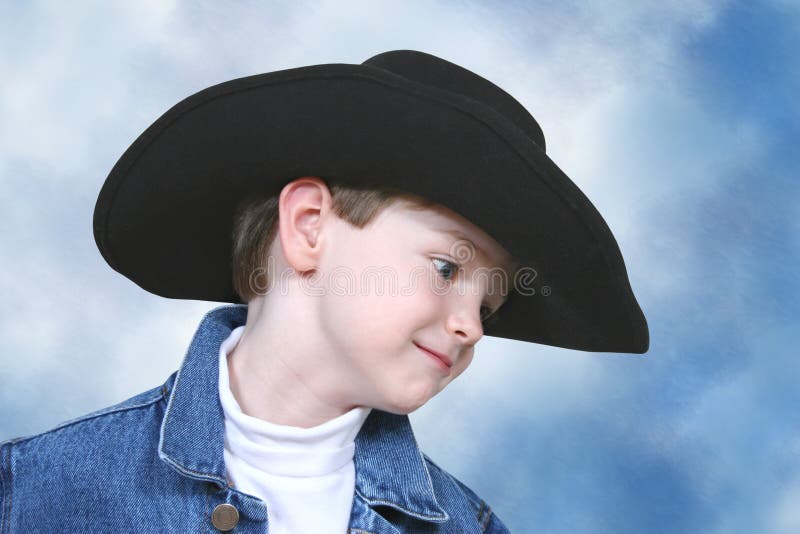 svart omslag för hatt för pojkecowboydenim arkivfoto svart omslag för hatt för pojkecowboydenim arkivfoto