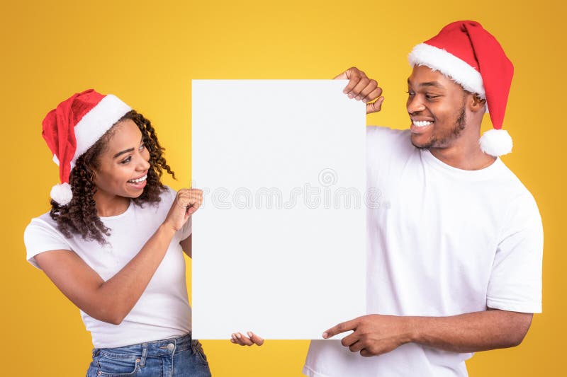 Svart par Blank Board med gula bakgrunder vid jul fotografering för bildbyråer
