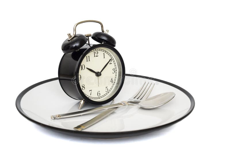 Svart ringklocka med gaffeln och kniv på plattan Isolerat på vit äta tid till Viktförlust eller bantar begrepp royaltyfria foton Svart ringklocka med gaffeln och kniv på plattan Isolerat på vit äta tid till Viktförlust eller bantar begrepp royaltyfria foton