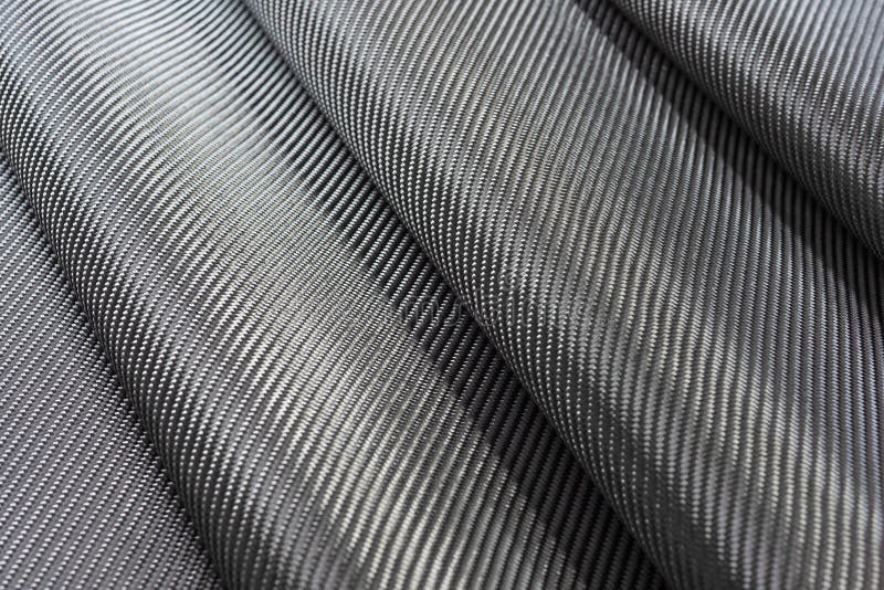 Svart vävd kolfiber eller Kevlar textur för bakgrund royaltyfri bild Svart vävd kolfiber eller Kevlar textur för bakgrund royaltyfri bild