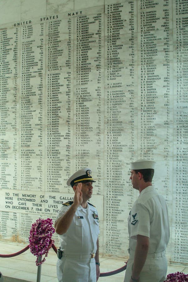 A Navy sailor is being sworn in. A Navy sailor is being sworn in