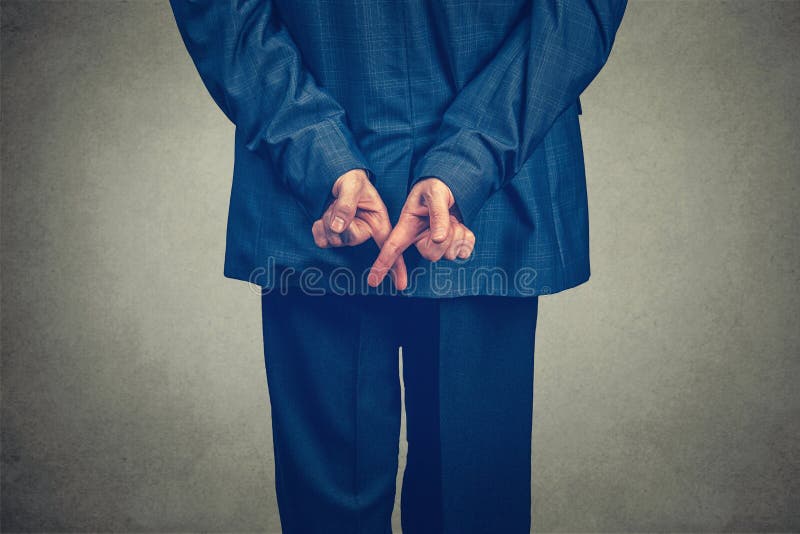 Swearing an Oath with Fingers Crossed Behind the Back Stock Photo ...