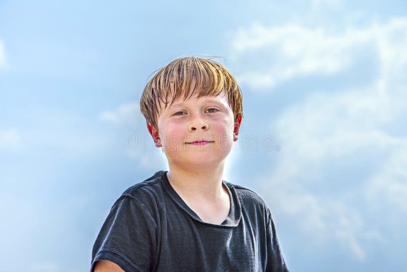 Sweating boy after sport looks confident