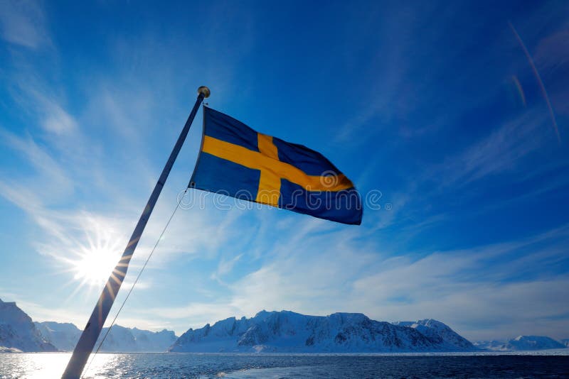 Sweden flag with blue sky. Rocky island with snow. White snowy mountain, blue glacier Iceberg twilight, ocean. Pink clouds with ic