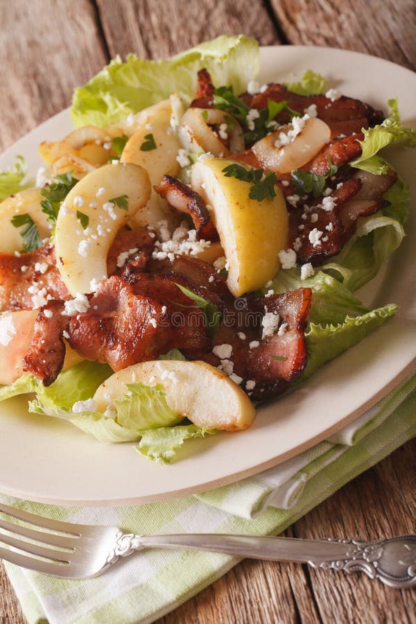 Swedish cuisine salad with bacon, onion, apple and goat cheese.