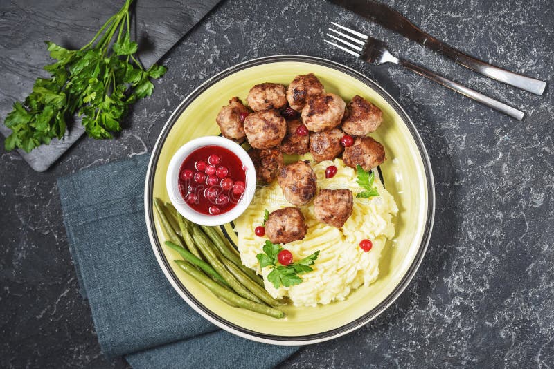 Swedish Meatballs with Mashed Potatoes and Green Beans on Black Stone Background Stock Image