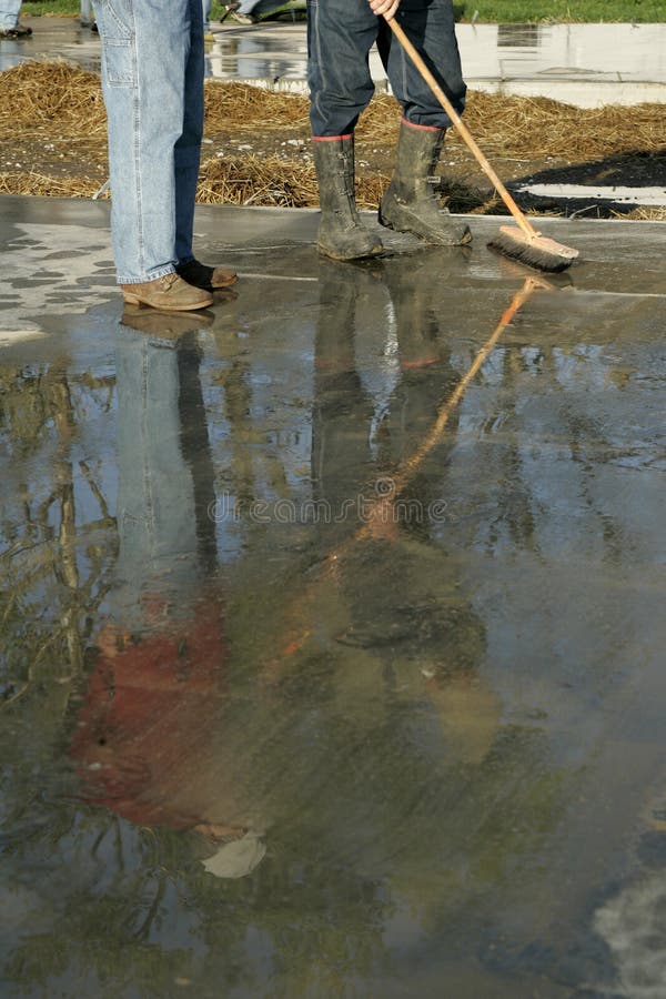 Sweeping Away the Rain stock photo. Image of workers, broom 1269574