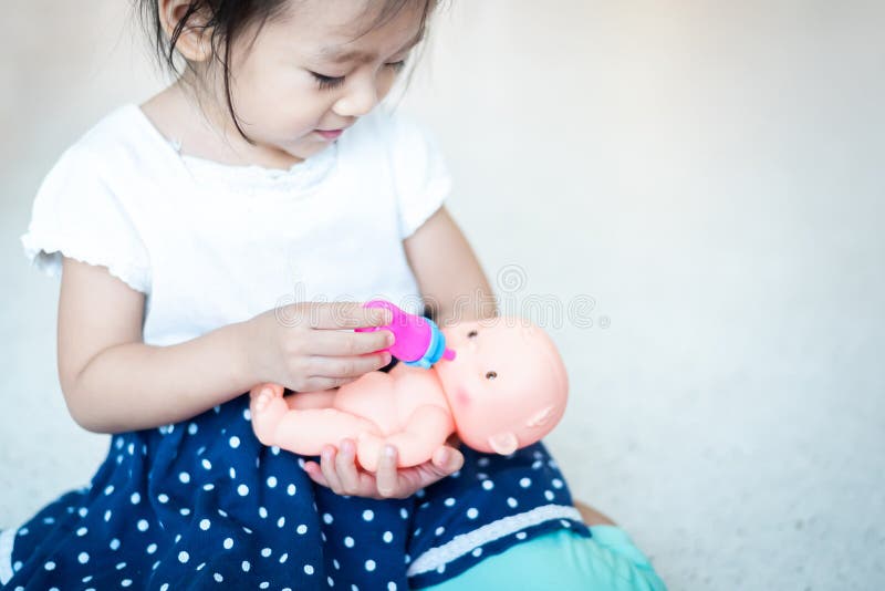 feeding doll baby
