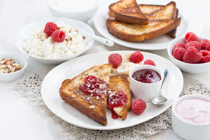 Sweet breakfast - crispy toasts with raspberries, banana and jam