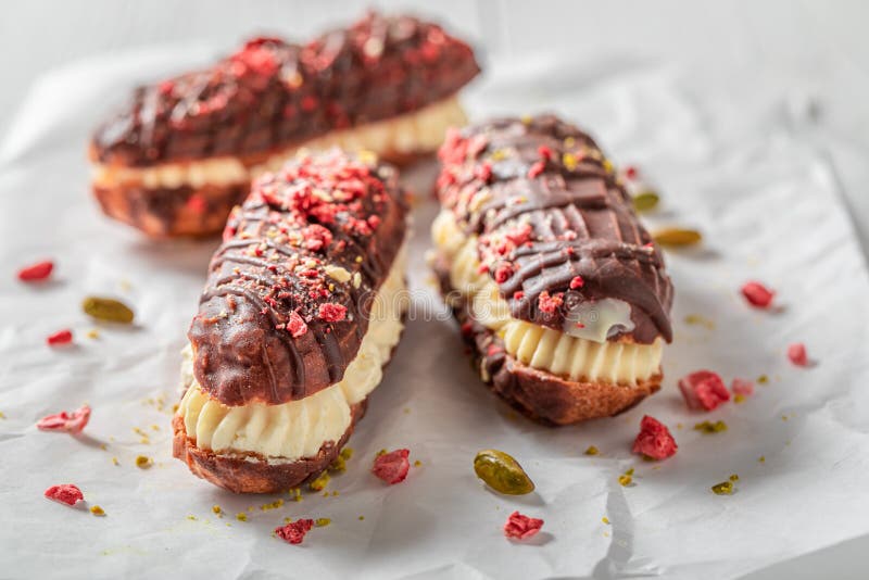 Sweet and Chocolate Eclairs with Chocolate and Whipped Cream Stock