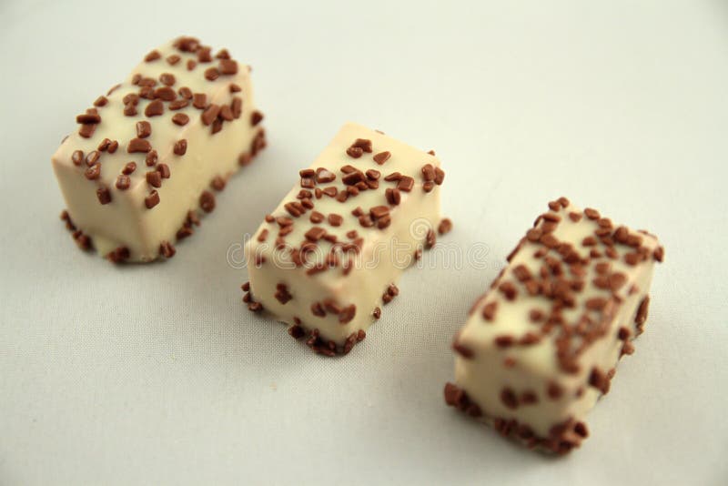 Sweet Chocolates with Soft Filling, Chocolate Pieces Stock Photo