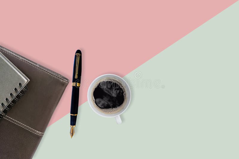 Sweet color office table with fountain pen , notebook and cup off coffee stock images Sweet color office table with fountain pen , notebook and cup off coffee stock images