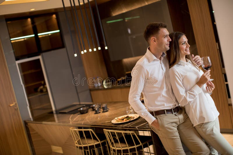 Sweet Couple Having Drinking Red Wine after a Romantic Dinner at Luxury