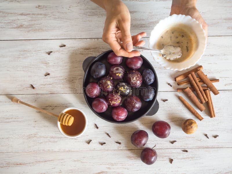 Sweet Dessert with Plum. Baking Plums in Sweet Sauce. Stock Photo