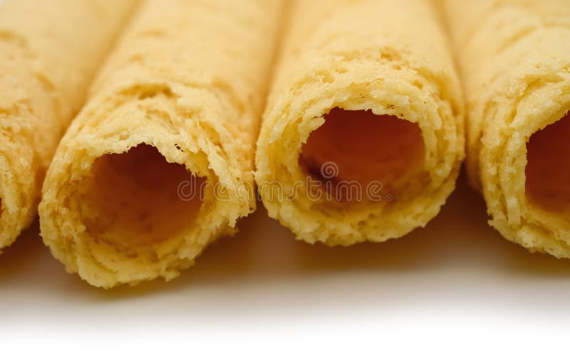 Sweet egg rolls close up on white background