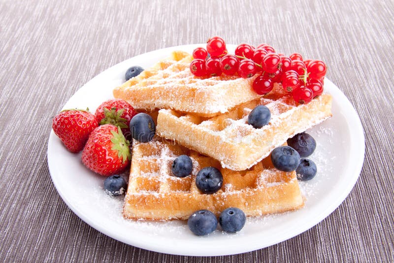 Sweet fresh tasty waffles with mixed fruits stock image Sweet fresh tasty waffles with mixed fruits stock image