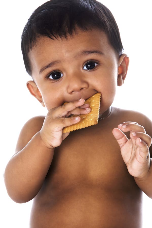 Sweet Indian Baby Eating a Cookie Stock Image - Image of infant, face