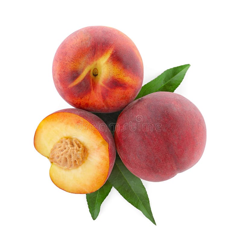 Sweet juicy peaches with leaves on white, top view. 