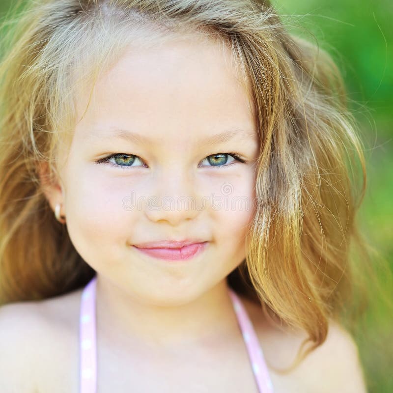 Portrait of Sweet Little Girl Wearing Glasses, Reading Book, Sit Stock