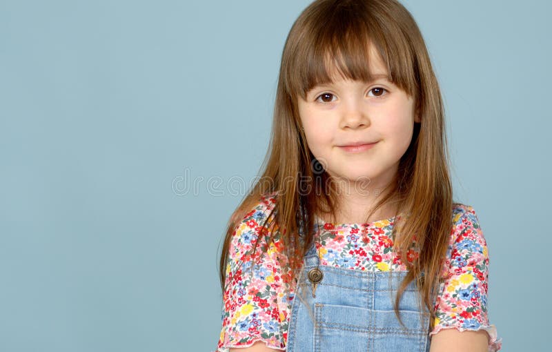 Sweet Little Girl 6-7 Years Old Posing in Dungarees Jeans and Flower Pattern Blouse on Blue Stock Photo - Image of pleased, jeans: 180760194 Sweet Little Girl 6-7 Years Old Posing in Dungarees Jeans and Flower Pattern Blouse on Blue Stock Photo - Image of pleased, jeans: 180760194