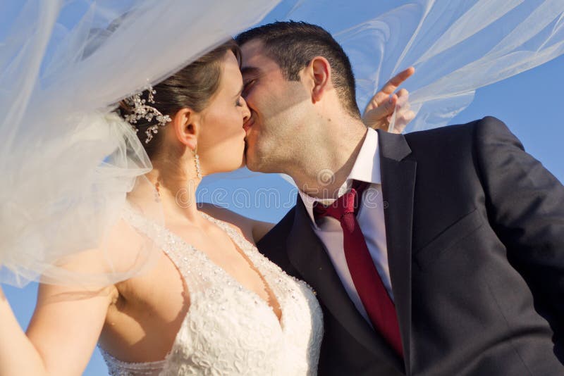 Sweet Newly Married Couple Kissing Outdoor stock photography Sweet Newly Married Couple Kissing Outdoor stock photography