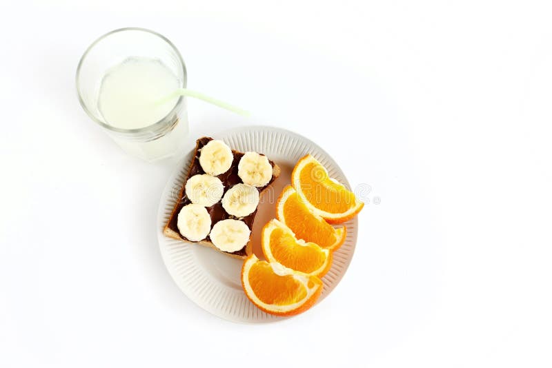 Sweet oranges and banana on bread with chocolate and fresh drink stock image Sweet oranges and banana on bread with chocolate and fresh drink stock image