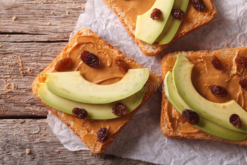 Sweet sandwiches with avocado, peanut cream closeup. horizontal